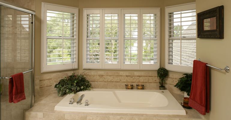 Plantation shutters in Boston bathroom.